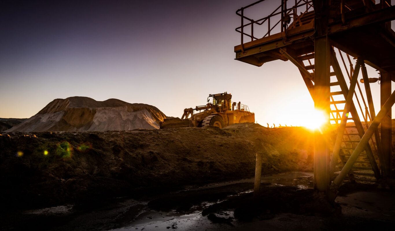 Front loader at sunset, Sunrise dam, Australia