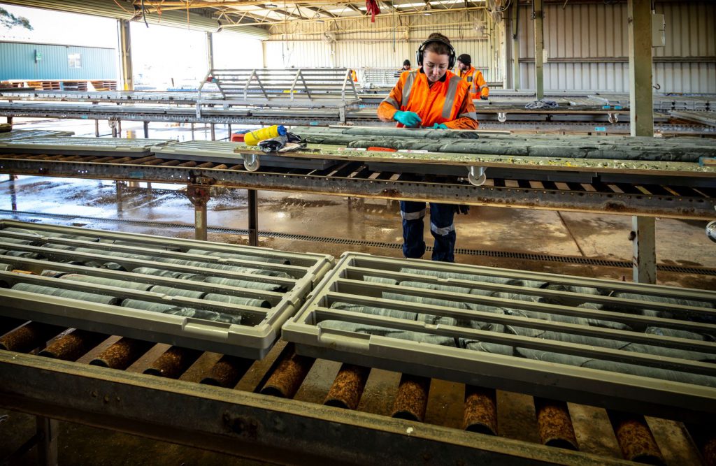 Geologist examining core samples, Sunrise dam, Australia