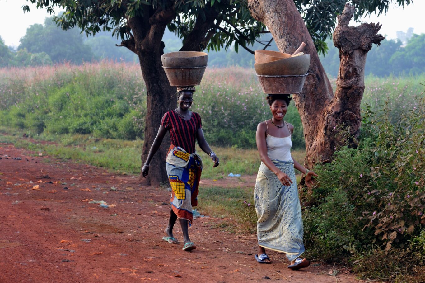 Women carrying baskets on their heads in Guinea